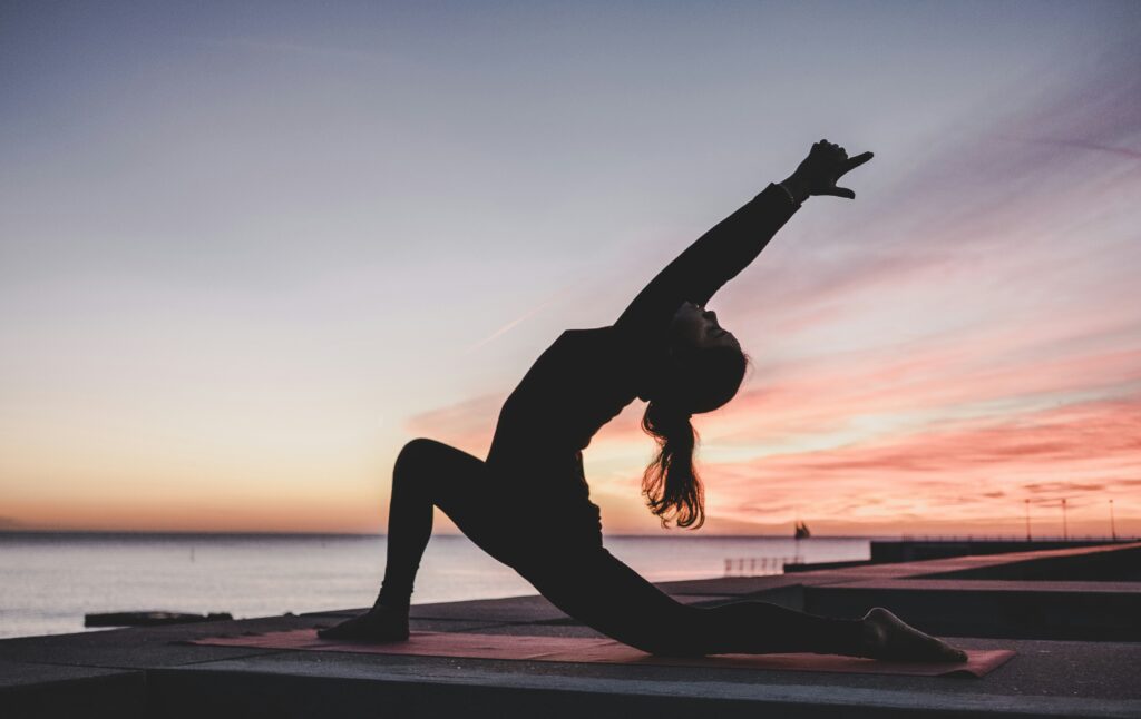 Woman practicing yoga for mind-body connection.