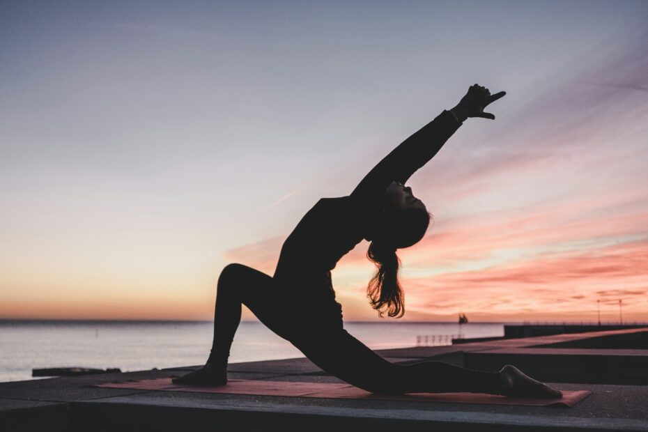 Woman practicing yoga for mind-body connection.