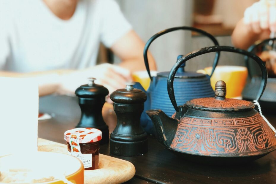 Friends sit together for a cup of tea