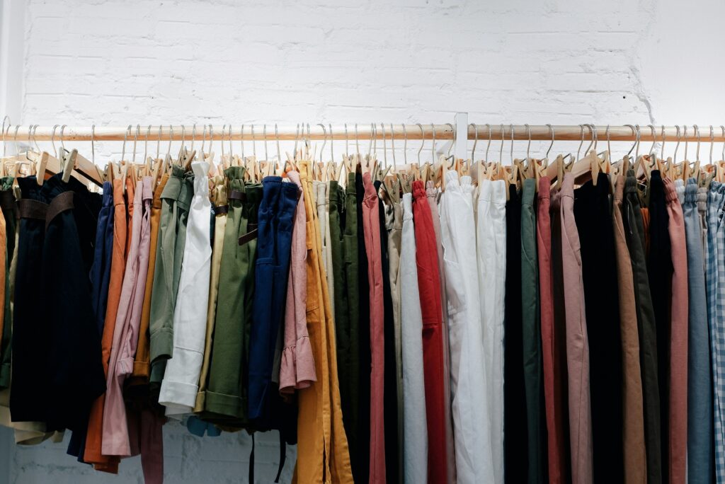 Clothes on a rack. 
Our wardrobes are often filled with the clothes we outgrow on our journey to midlife.