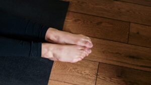Feet hanging off the end of a yoga mat. These are not my feet because they didn't hang off the end of a yoga mat this morning. Sigh.